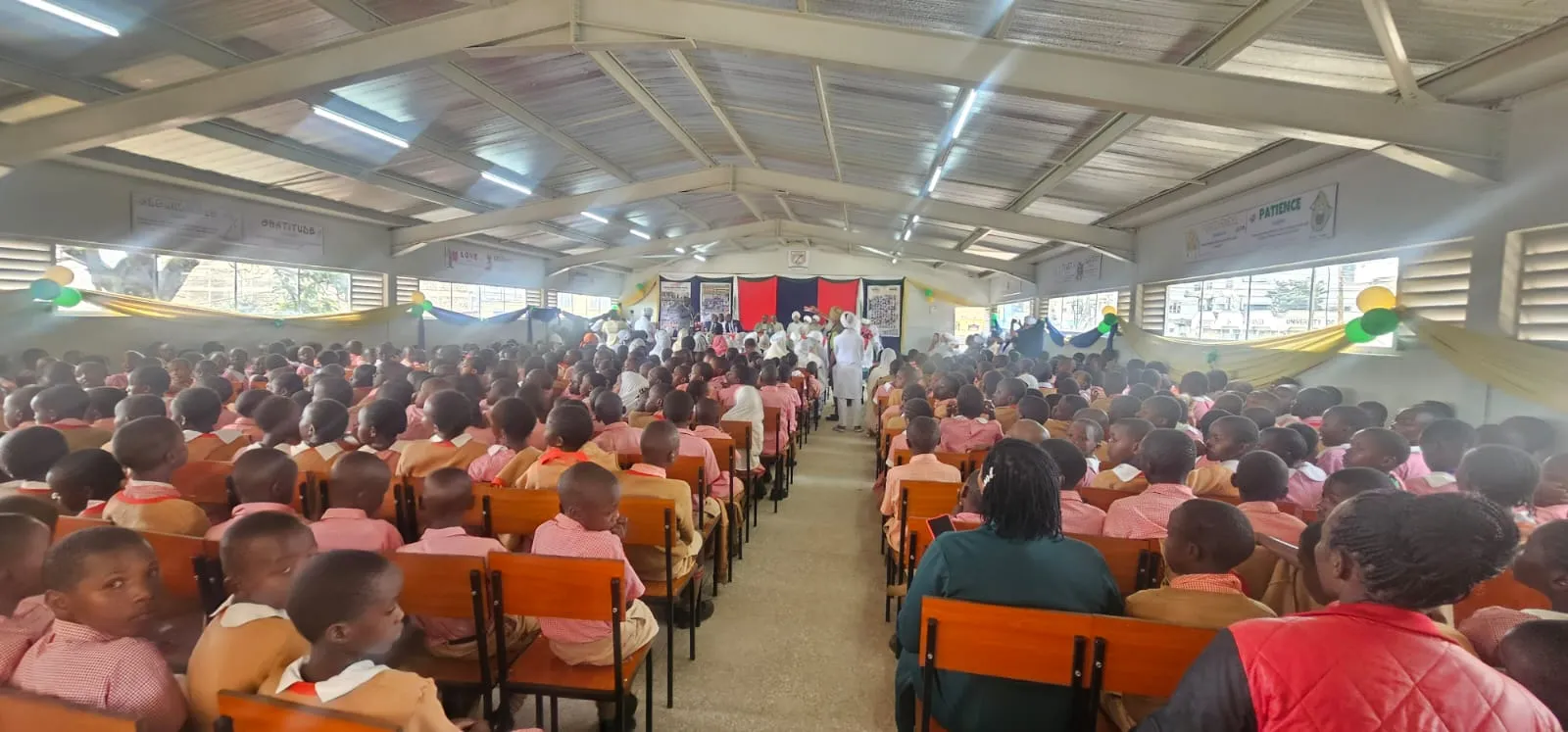 Pupils gathered in a school assembly hall